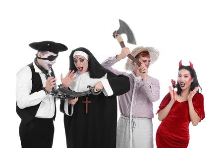 Group of friends in costumes for Halloween party on white backgroundの写真素材