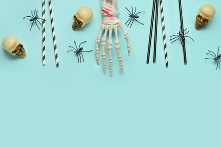 Composition with drinking straws and Halloween decor on color backgroundの写真素材