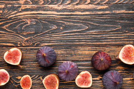 Fresh ripe figs on wooden backgroundの写真素材