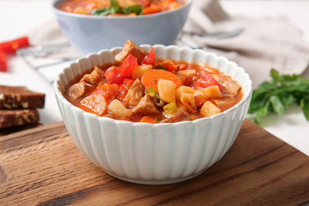 Bowl of tasty beef stew on tableの写真素材