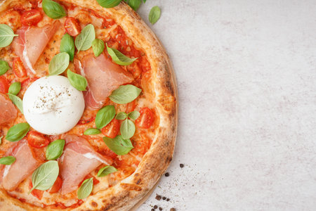 Tasty pizza with Burrata cheese on light backgroundの写真素材
