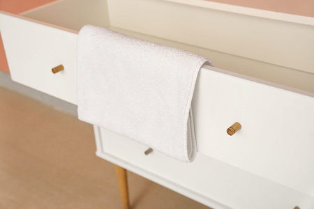 Opened drawer with clean towel, closeup