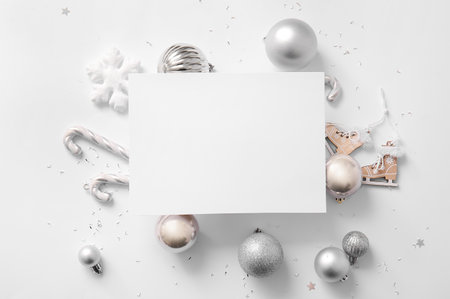Blank card with Christmas balls, snowflake and candy canes on white backgroundの写真素材