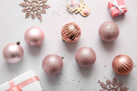 Christmas balls, snowflakes and gift boxes on lilac backgroundの写真素材