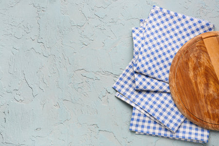 Wooden kitchen board and clean napkins onの写真素材
