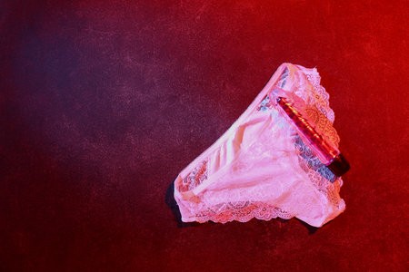 Vibrator with panties on dark color backgroundの写真素材