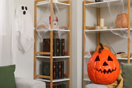 Halloween pumpkin on sofa in living roomの写真素材