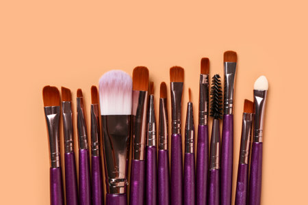 Makeup brushes on orange backgroundの写真素材