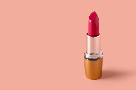 Stylish new lipstick on pink backgroundの写真素材