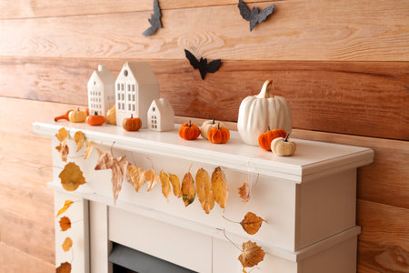 Interior of living room decorated for Halloween with fireplace and paper batsの写真素材