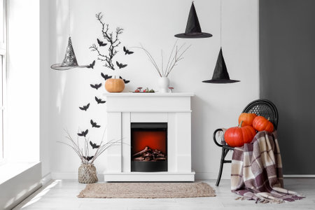 Interior of living room decorated for Halloween with fireplace and paper batsの写真素材