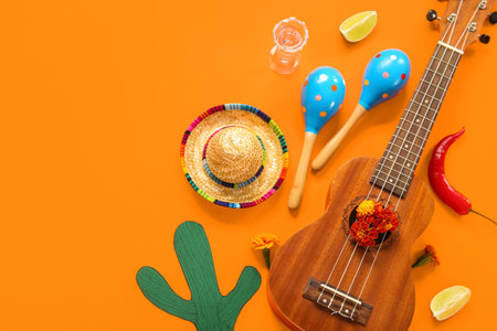 Composition with guitar and Mexican symbols for Independence Day on orange background