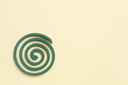 Mosquito spiral on yellow backgroundの写真素材