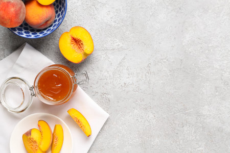 Composition with jar of tasty peach jam and fresh fruits on grunge background