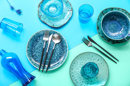 Beautiful table setting on color backgroundの写真素材