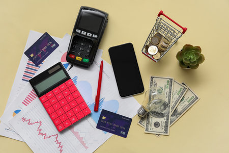 Composition with credit cards, calculator, smartphone and money on beige background. House rent conceptの写真素材