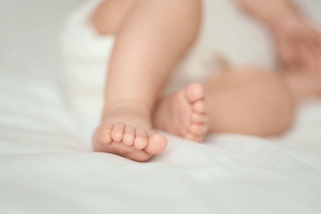 Little baby sleeping on bed, closeup