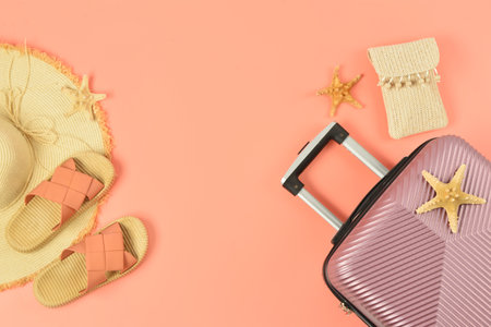 Composition with stylish beach accessories, suitcase and starfishes on color backgroundの写真素材