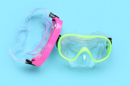 Different swimming masks on blue background
