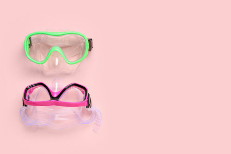 Different swimming masks on pink backgroundの写真素材