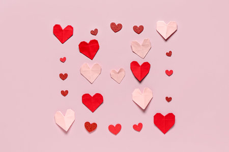 Beautiful hearts made of paper on lilac background. National Sweetest Dayの写真素材