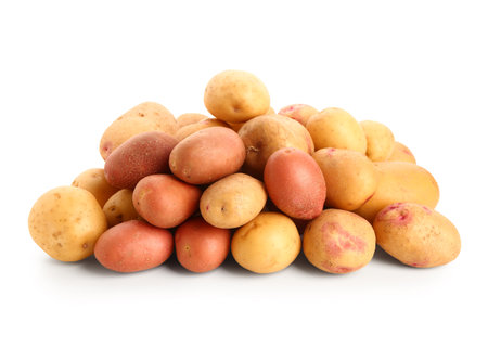 Heap of fresh raw potatoes on white backgroundの写真素材