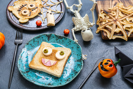 Composition with tasty Halloween breakfast and decorations on color backgroundの写真素材