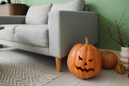 Interior of living room decorated for Halloween with sofa and pumpkinsの写真素材