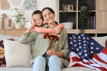 Little boy hugging his mother at home. Veterans Day celebrationの写真素材