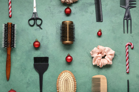 Hairdressing tools with Christmas decor on green backgroundの写真素材
