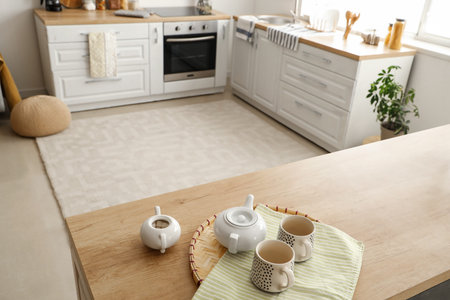 Tea set with sugar bowl on table in kitchen