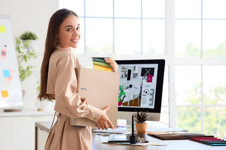 Female interior designer working with fabric samples in office