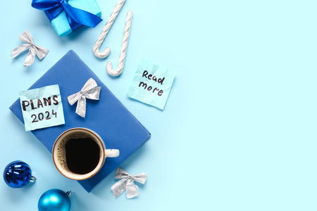 Sticky notes with different goals for 2024, gift box, cup of coffee and Christmas decorations on...