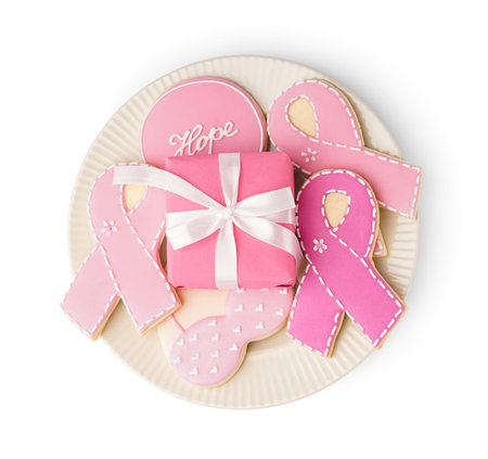 Plate with pink cookies isolated on white background. Breast cancer awareness conceptの写真素材