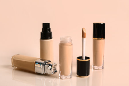 Bottles of makeup foundation on yellow backgroundの写真素材