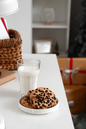 Christmas cookies with milk on table in living room, closeupの写真素材