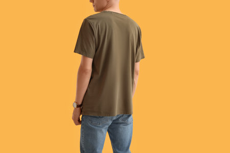 Man in stylish t-shirt on orange background