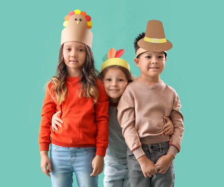 Cute little children on green background. Thanksgiving Day celebrationの写真素材