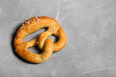 Soft pretzel on gray backgroundの写真素材