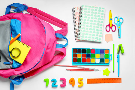 Composition with stylish school backpack and different stationery isolated on white background