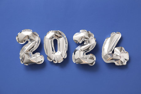 Figure 2024 made of balloons on blue backgroundの写真素材