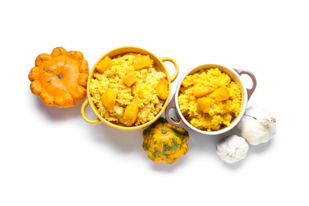 Pots of tasty millet porridge with pumpkin on white backgroundの写真素材