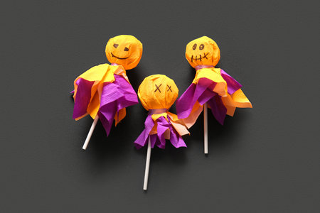 Sweet lollipops for Halloween party on black backgroundの写真素材