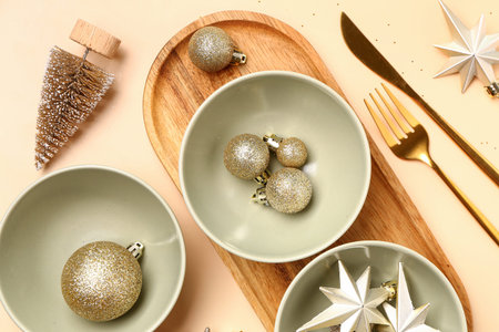 Beautiful table setting with Christmas decorations on orange backgroundの写真素材