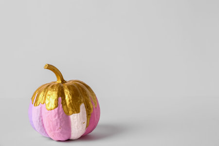 Painted pumpkin on white backgroundの写真素材