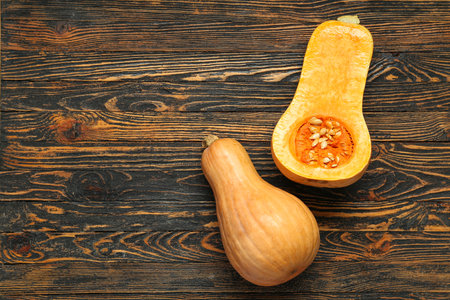 Fresh pumpkins on wooden backgroundの写真素材