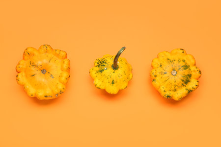 fresh pumpkins on orange backgroundの写真素材