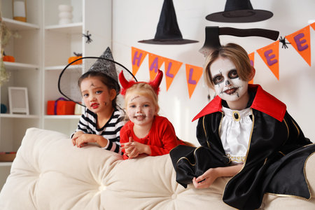 Little children celebrating Halloween at homeの写真素材