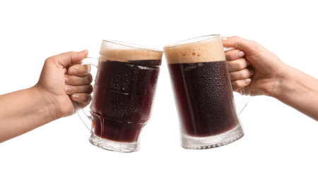Women with mugs of dark beer on white backgroundの写真素材