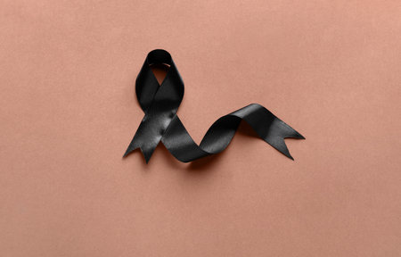 Black funeral ribbon on brown backgroundの写真素材